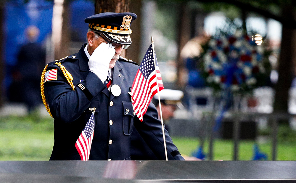 Sam Pulia, of Westchester, Ill., a former police officer, wipes a tear while looking at the name of his cousin, New York firefighter Thomas Anthony Casoria, at the South Pool of the 9/11 Memorial during ceremonies marking the 17th anniversary of the terrorist attacks in New York, New York, USA, 11 September 2018.
17th Anniversary of 9/11 terror attack in New York, USA - 11 Sep 2018