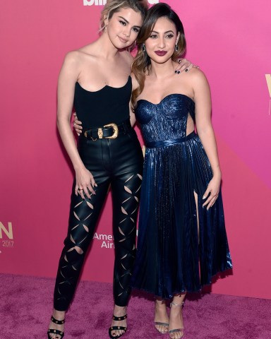 Selena Gomez, left, and Francia Raisa arrive at the Billboard Women in Music event at the Ray Dolby Ballroom on Thursday, Nov. 30, 2017, in Los Angeles. (Photo by Chris Pizzello/Invision/AP)