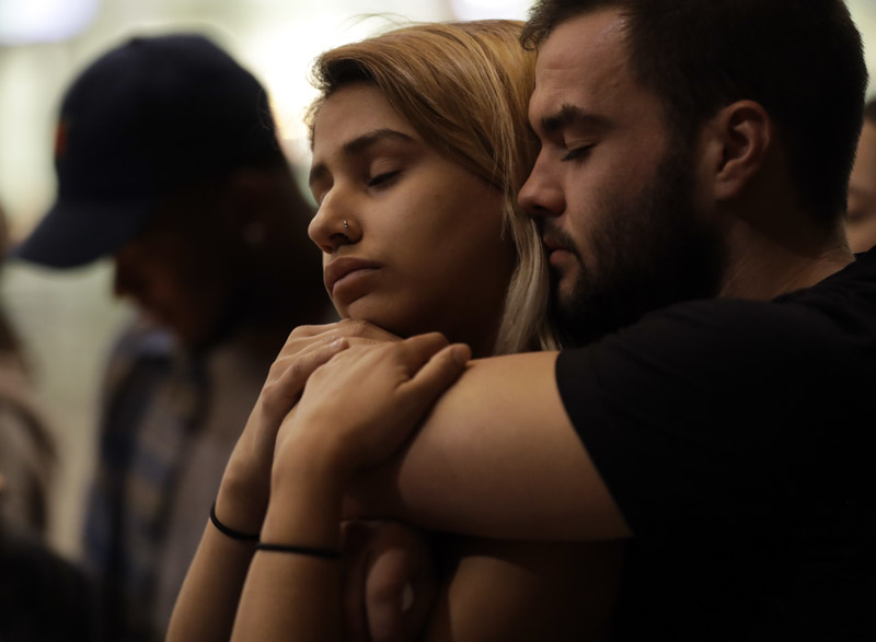 University of Nevada Las Vegas students Raymond Lloyd, right, and Karla Rodriguez take part in a vigil, in Las Vegas. A gunman on the 32nd floor of the Mandalay Bay casino hotel rained automatic weapons fire down on the crowd of over 22,000 at an outdoor country music festival Sunday
Shooting, Las Vegas, USA - 02 Oct 2017