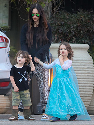 Megan Fox with her son Noah in a dress