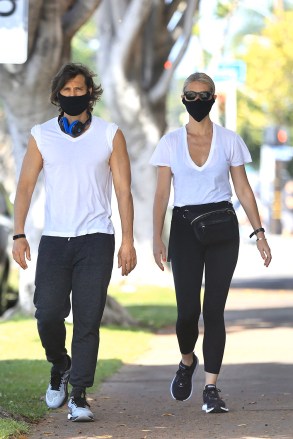 EXCLUSIVE: Gwyneth Paltrow and Brad Falchuk enjoy a Sunday stroll in the sunshine. The couple were wearing face masks as the took a break from quarantine amid the Los Angeles Covid-19 lockdown. 17 May 2020 Pictured: Gwyneth Paltrow, Brad Falchuk. Photo credit: Rachpoot/MEGA TheMegaAgency.com +1 888 505 6342 (Mega Agency TagID: MEGA666691_001.jpg) [Photo via Mega Agency]