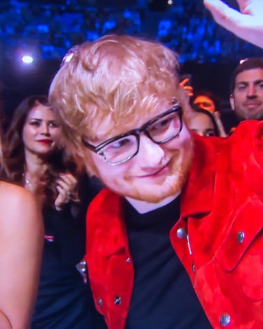 Video grab of Ed Sheeran and his girlfriend Cherry Seaborn at the Brit Awards on Feb 21st.

Pop star Ed Sheeran has revealed that his fiancee MADE an engagement ring for him, after responding to rumours that he secretly tied the knot.

The Shape of You singer, who was spotted wearing a silver band on his wedding finger at a gig earlier this week, said his childhood sweetheart, Cherry Seaborn, made the ring for him out of silver plate.

The 27-year-old, whose interview on the red carpet at the BRIT Awards was shown on ITV's Lorraine this morning, said: "It's the same commitment either way, so Cherry made it for me out of silver plate and I really like it. I haven't told anyone else about it yet."

* No UK Papers Or Web * Magazines Only / Worldwide Rights

Pictured: Cherry Seaborn,Ed Sheeran
Ref: SPL4188722 240218 NON-EXCLUSIVE
Picture by: Flynet - SplashNews / SplashNews.com

Splash News and Pictures
USA: +1 310-525-5808
London: +44 (0)20 8126 1009
Berlin: +49 175 3764 166
photodesk@splashnews.com

World Rights