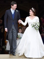 FILE - In this Friday, Oct. 12, 2018 file photo, Britain's Princess Eugenie and Jack Brooksbank leave St George's Chapel after their wedding at Windsor Castle, in Windsor, England. Princess Eugenie and her husband Jack Brooksbank annouced on Friday, Sept. 25, 2020, they are expecting their first baby in early 2021. (Toby Melville, Pool via AP, File)