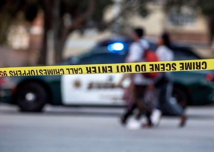 A group of persons walk in front of a Broward County sheriff car after a shooting at Marjory Stoneman Douglas High School in Parkland, Florida, USA, 14 February 2018. Multiple fatalities have been reported and several more injured at a high school northwest of Miami. According to law enforcement the suspect is in custody. Some media are reporting the suspect as former student, Nicolas Cruz.
School shooting in Parkland, Florida, USA - 14 Feb 2018