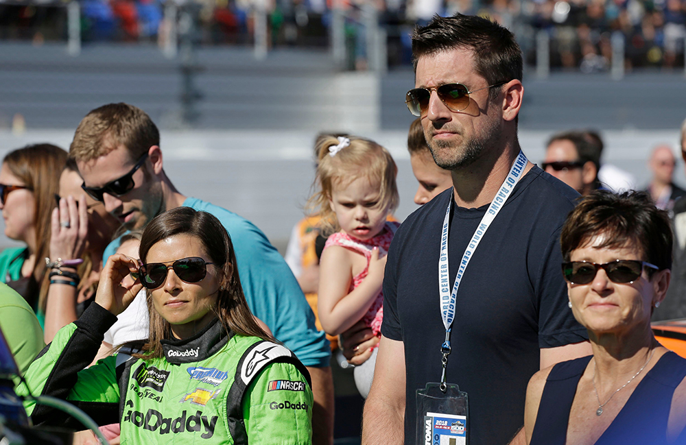 Danica Patrick, Aaron Rodgers. Danica Patrick, left, stands with Green Bay Packers quarterback Aaron Rodgers, right, before the NASCAR Daytona 500 Cup series auto race at Daytona International Speedway in Daytona Beach, Fla
NASCAR Daytona 500 Auto Racing, Daytona Beach, USA - 18 Feb 2018