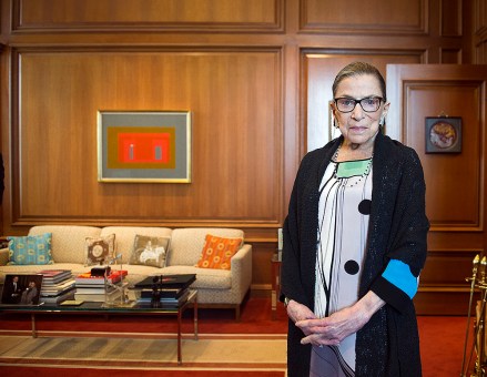 FILE - In this July 31, 2014, file photo, Associate Justice Ruth Bader Ginsburg in her Supreme Court chambers in Washington. In different circumstances, Ginsburg might be on a valedictory tour in her final months on the Supreme Court. But in the era of Donald Trump, the 84-year-old Ginsburg is packing her schedule and sending signals she intends to keep her seat on the bench for years. (AP Photo/Cliff Owen, File)