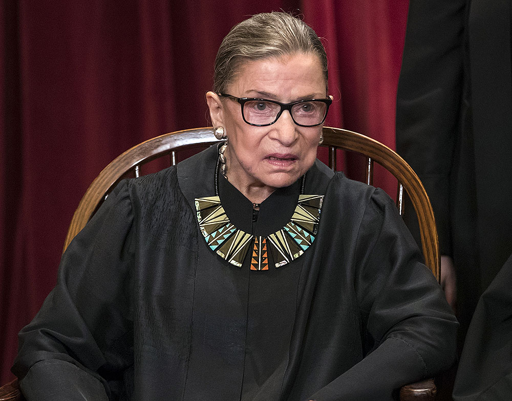 FILE - In this June 1, 2017, file photo, Associate Justice Ruth Bader Ginsburg joins other justices of the U.S. Supreme Court for an official group portrait at the Supreme Court Building in Washington. In different circumstances, Ginsburg might be on a valedictory tour in her final months on the Supreme Court. But in the era of Donald Trump, the 84-year-old Ginsburg is packing her schedule and sending signals she intends to keep her seat on the bench for years. (AP Photo/J. Scott Applewhite, File)