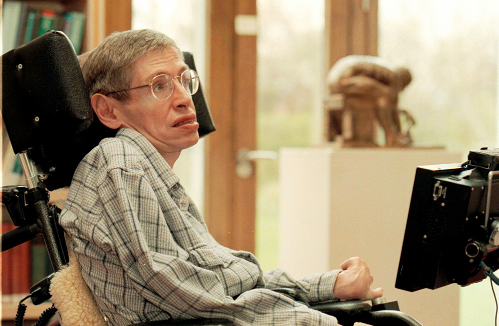 HAWKING Physicist Stephen Hawking is seen in the library of The Issac Newton Institute of Mathematics in Cambridge University with a new custom-built computer designed espescially for him. The scientist, now 55, has suffered the debilitation of amyotrophic lateral sclerosis, Lou Gehrig's disease, since his 20s. In the background is Eduardo Palozzi's Statue of Issac Newton
BRITAIN WIRED HAWKING, CAMBRIDGE, United Kingdom England