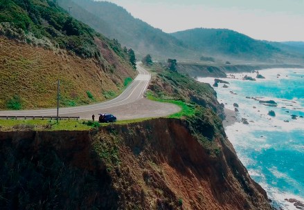 In this March 28, 2018 aerial file image from Alameda County Sheriff's Office drone video courtesy of Mendocino County shows the pullout where the SUV of Jennifer and Sarah Hart was recovered off the off Pacific Coast Highway 1, near Westport, Calif. The SUV carrying the large, free-spirited family from Washington state accelerated straight off the scenic California cliff and the deadly wreck may have been intentional, authorities said Sunday, April 1, 2018. (Alameda County Sheriff's Office via AP, File)