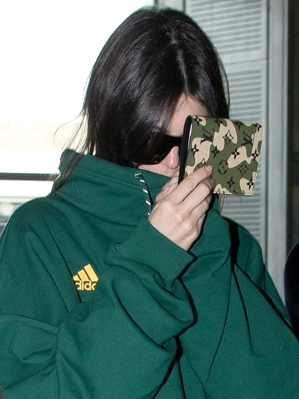 ** RIGHTS: ONLY UNITED STATES, CANADA ** Paris, FRANCE  - Kendall Jenner, arrives casual at the Paris airport, wearing a green Adidas pullover and a Louis Vuitton's wallet, arrives at Paris-Charles-de-Gaulle's Airport, to take a flight for Los Angeles from Paris.Pictured: Kendall JennerBACKGRID USA 5 APRIL 2018 BYLINE MUST READ: Best Image / BACKGRIDUSA: +1 310 798 9111 / usasales@backgrid.comUK: +44 208 344 2007 / uksales@backgrid.com*UK Clients - Pictures Containing ChildrenPlease Pixelate Face Prior To Publication*