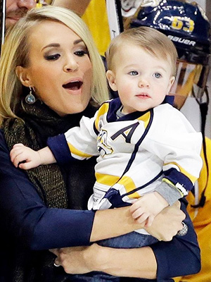 Mike Fisher, Carrie Underwood, Isaiah Fisher Nashville Predators forward Mike Fisher is honored for his 1,000th NHL hockey game before the first period of a game against the Los Angeles Kings, in Nashville, Tenn. With Fisher is his wife, singer Carrie Underwood, and their son, IsaiahKings Predators Hockey, Nashville, USA
