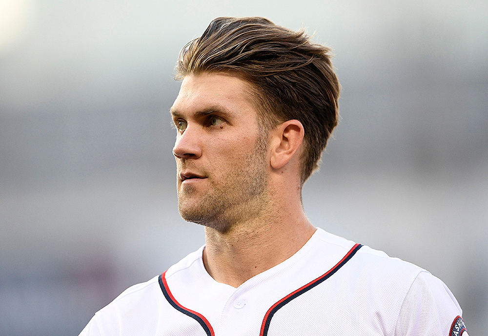 Washington Nationals' Bryce Harper stands on the field after the third inning of a baseball game against the New York Yankees, in Washington. This game is a makeup of a postponed game from May 16
Yankees Nationals Baseball, Washington, USA - 18 Jun 2018