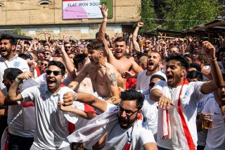 England fans celebrate after England score their first goal in the World Cup Quarter Final against Sweden as it is shown on the big screen at Flat Iron Square in London.England fans celebrate World Cup quarter final win, London, UK - 07 Jul 2018