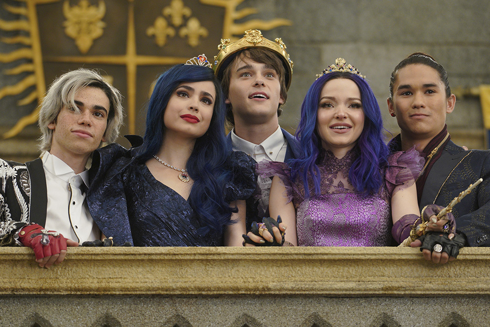 DESCENDANTS 3 - This highly anticipated third installment in the global hit Disney Channel Original Movie franchise continues the contemporary saga of good versus evil as the teenage daughters and sons of Disney's most infamous villains-Mal, Evie, Carlos and Jay (also known as the villain kids or VKs)-return to the Isle of the Lost to recruit a new batch of villainous offspring to join them at Auradon Prep. When a barrier breach jeopardizes the safety of Auradon during their departure off the Isle, Mal resolves to permanently close the barrier, fearing that nemeses Uma and Hades will wreak vengeance on the kingdom. Despite her decision, an unfathomable dark force threatens the people of Auradon and it's up to Mal and the VKs to save everyone in their most epic battle yet. "Descendants 3" is set to premiere on FRIDAY, AUG. 2 (8:00-10:00 p.m. EDT), on Disney Channel and DisneyNOW. (Disney Channel/David Bukach)
CAMERON BOYCE, SOFIA CARSON, MITCHELL HOPE, DOVE CAMERON, BOOBOO STEWART