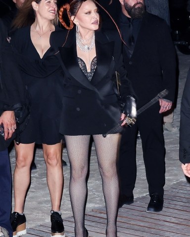 Miami, FL  - Pop icon Madonna stuns as she steps out in a risqué black lace ensemble and edgy orange braids for a night of partying on South Beach. The youthful looking 64-year-old trendsetter proves she can party with the best of them as she is seen attending an after party with her daughter Lourdes Leon during Art Basel. The event was set in honor of Madonna.Pictured: MadonnaBACKGRID USA 1 DECEMBER 2022 USA: +1 310 798 9111 / usasales@backgrid.comUK: +44 208 344 2007 / uksales@backgrid.com*UK Clients - Pictures Containing ChildrenPlease Pixelate Face Prior To Publication*