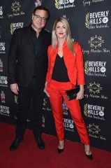 Bob Saget, Kelly Rizzo. Bob Saget, left, and Kelly Rizzo attend the Opening Night of the 2018 Beverly Hills Film Festival at the TCL Chinese 6 Theatres, in Los AngelesOpening Night of the 2018 Beverly Hills Film Festival, Los Angeles, USA - 04 Apr 2018