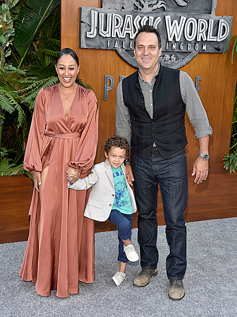 Tamera Mowry-Housley, Adam Housley, Aden. Tamera Mowry-Housley, left, Adam Housley, right, and their son Aden arrive at the Los Angeles premiere of "Jurassic World: Fallen Kingdom" at the Walt Disney Concert Hall on
LA Premiere of "Jurassic World: Fallen Kingdom", Los Angeles, USA - 12 Jun 2018