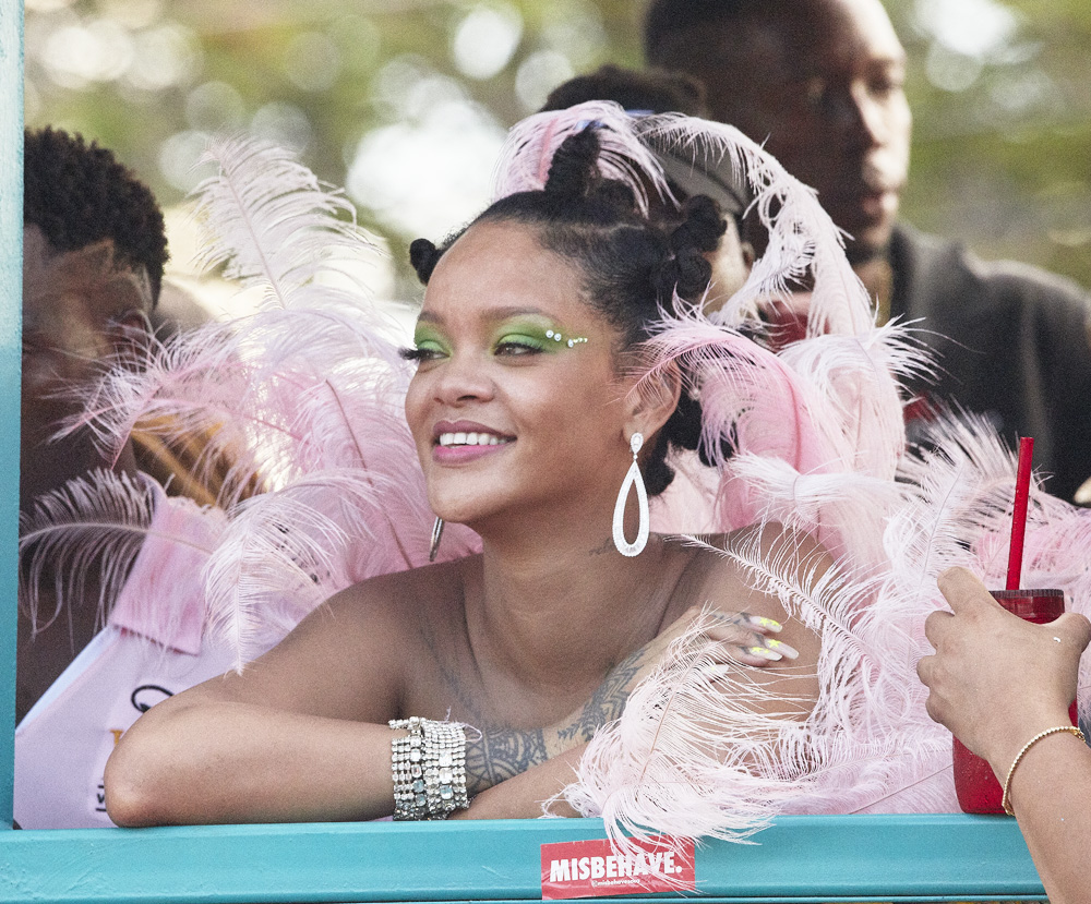 Rihanna gets visibly emotional many times when she sees her family and friends at Crop Over Festival in her native Barbados. She is seen pleading with police officer to give her float more time to stall on the road while she takes photos with friends and family. The iconic entertainer un-ironically sticks a "Misbehave" sticker in front of her on the float and then proceeds to smoke cigars.
Seen coincidentally in green eye make up and nails just a few days after she followed Spotify, whose logo is green, on Instagram, sending fans into a frenzy.

Pictured: Rihanna
Ref: SPL5107670 050819 NON-EXCLUSIVE
Picture by: SplashNews.com

Splash News and Pictures
Los Angeles: 310-821-2666
New York: 212-619-2666
London: 0207 644 7656
Milan: +39 02 56567623
photodesk@splashnews.com

World Rights