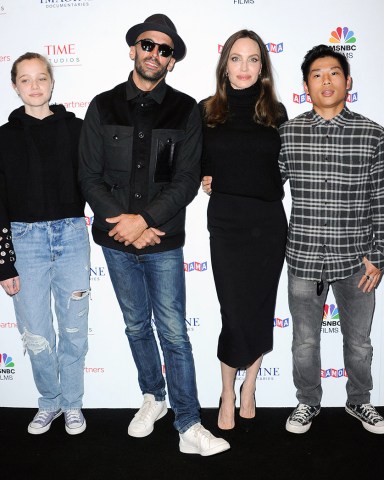 Shiloh Jolie-Pitt, street artist JR, actress Angelina Jolie and Pax Jolie-Pitt
'PAPER & GLUE' film premiere, Los Angeles, California, USA - 18 Nov 2021