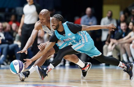 Home team's Famous Los, right, and Away team's Ray Allen chase the ball during the first half of an NBA All-Star Celebrity basketball game in Charlotte, N.C., Friday, Feb. 15, 2019. (AP Photo/Gerry Broome)