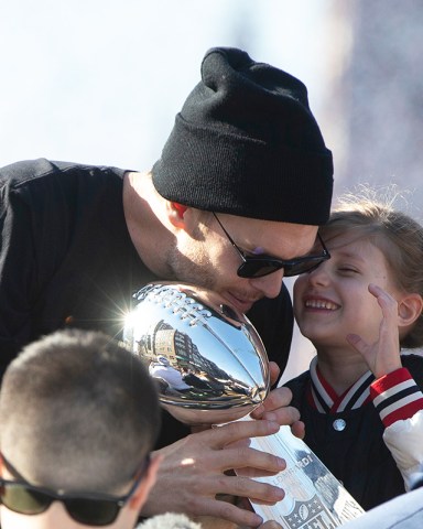 Super Bowl LIII Champions New England Patriots quarterback Tom Brady (L) talks with his daughter Vivian Lake Brady (R) while holding the Vince Lombardi Trophy as they ride a duck boat during a celebration parade on the streets of Boston, Massachusetts, USA 05 February 2019. The New England Patriots defeated the Los Angeles Rams to win Super Bowl LIII, their sixth championship in seventeen years.
New England Patriots Super Bowl Championship Parade, Boston, USA - 05 Feb 2019