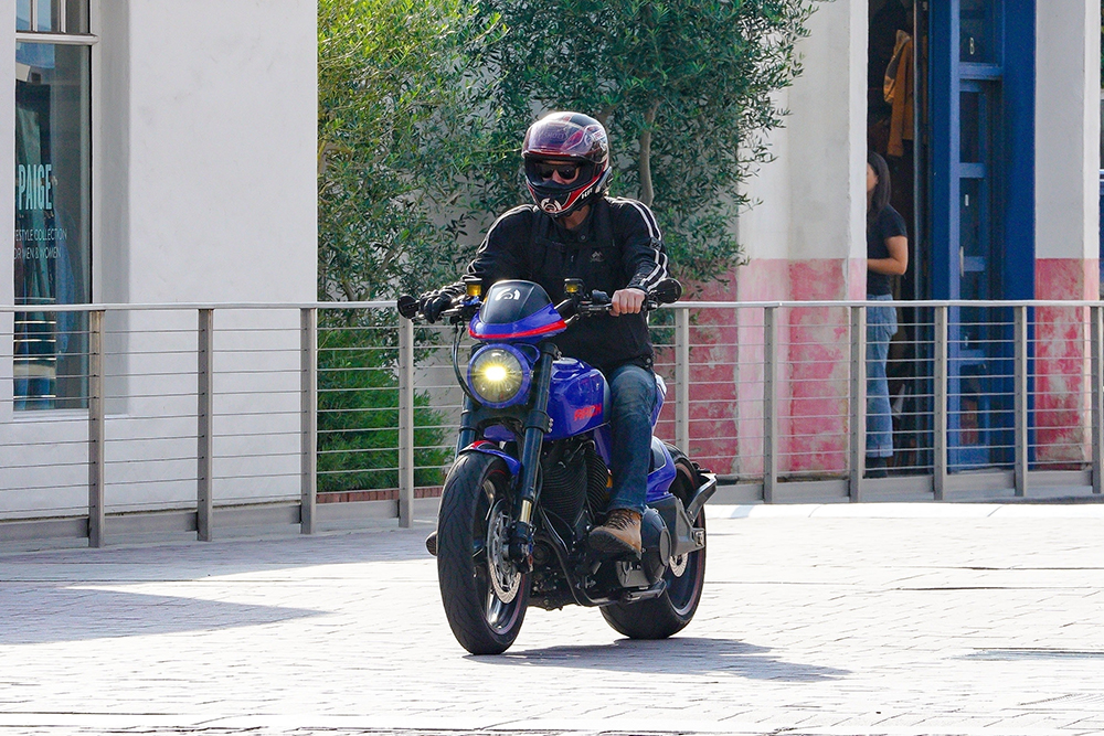 Keanu Reeves Cruises Motorcycle BG