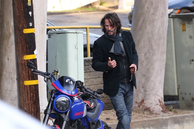 Keanu Reeves rides his motorcycle to lunch