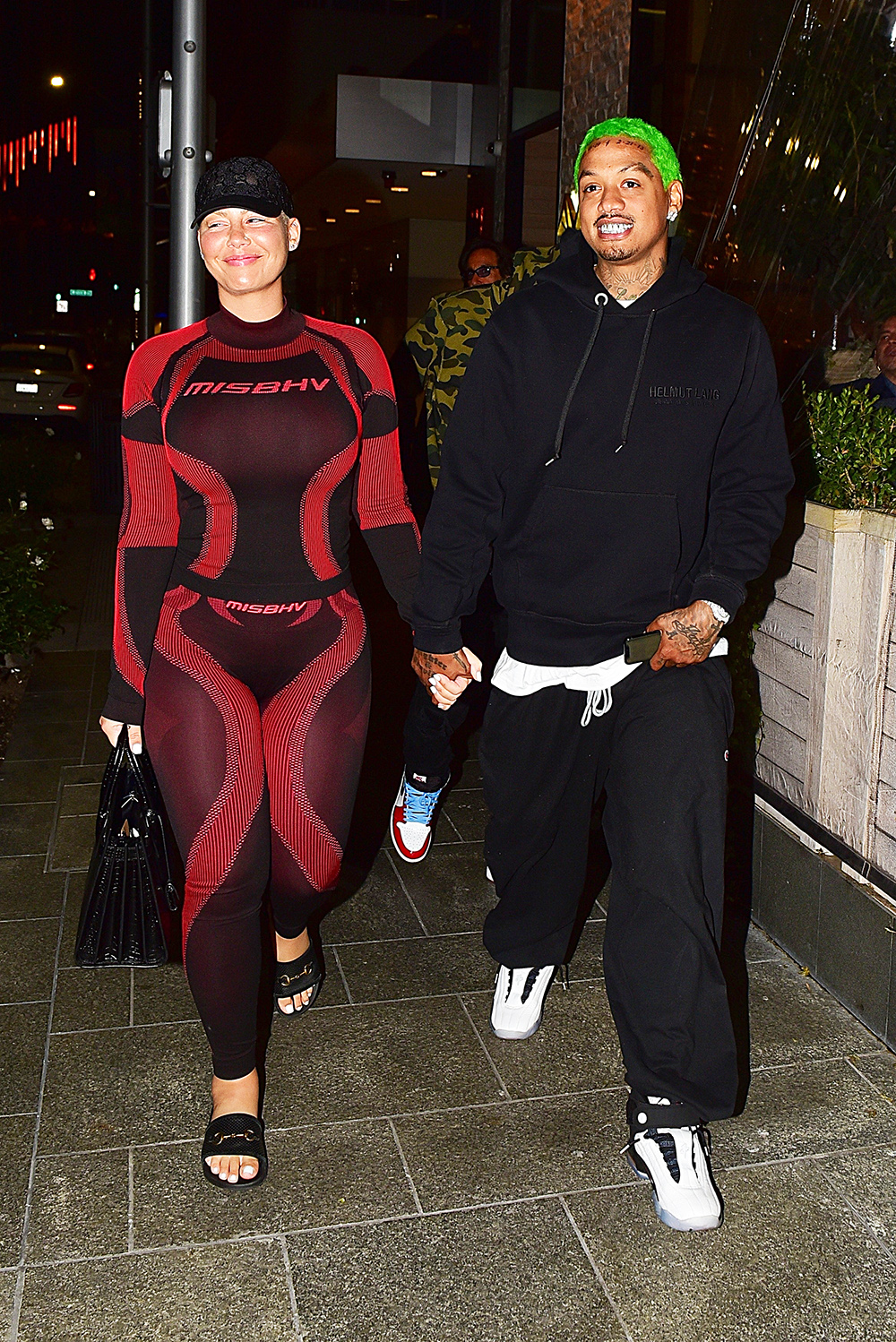 Amber Rose and boyfriend Alexander "AE" Edwards kiss for the fans after dinner in Beverly Hills