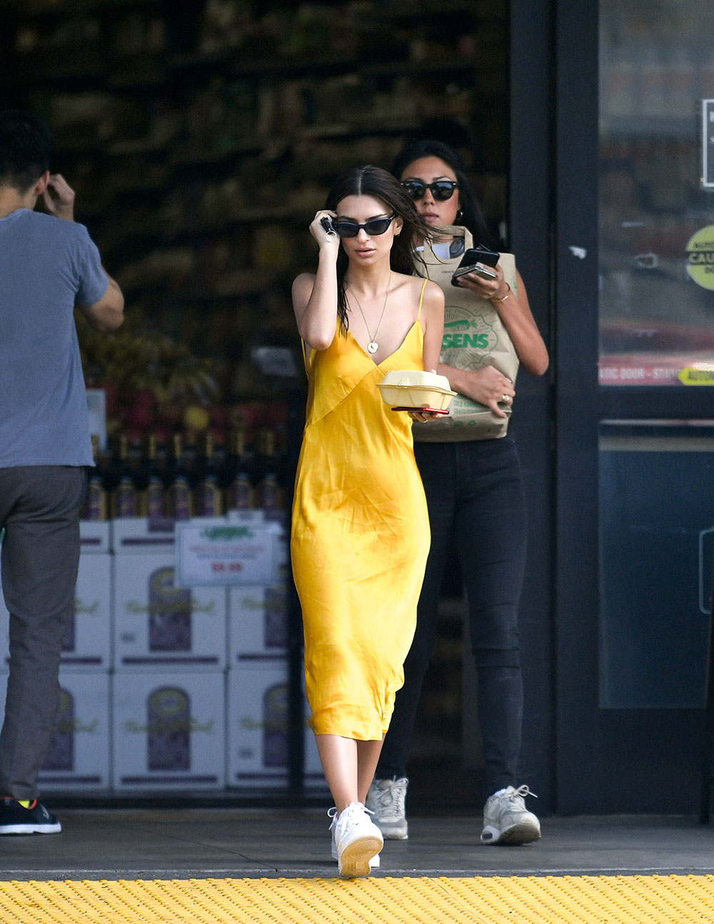 EXCLUSIVE: Emily Ratajkowski was seen leaving her local supermarket wearing a bright yellow as she leaves an organic market with her friend. 22 Apr 2019 Pictured: Emily Ratajkowski. Photo credit: MEGA TheMegaAgency.com +1 888 505 6342 (Mega Agency TagID: MEGA403885_006.jpg) [Photo via Mega Agency]