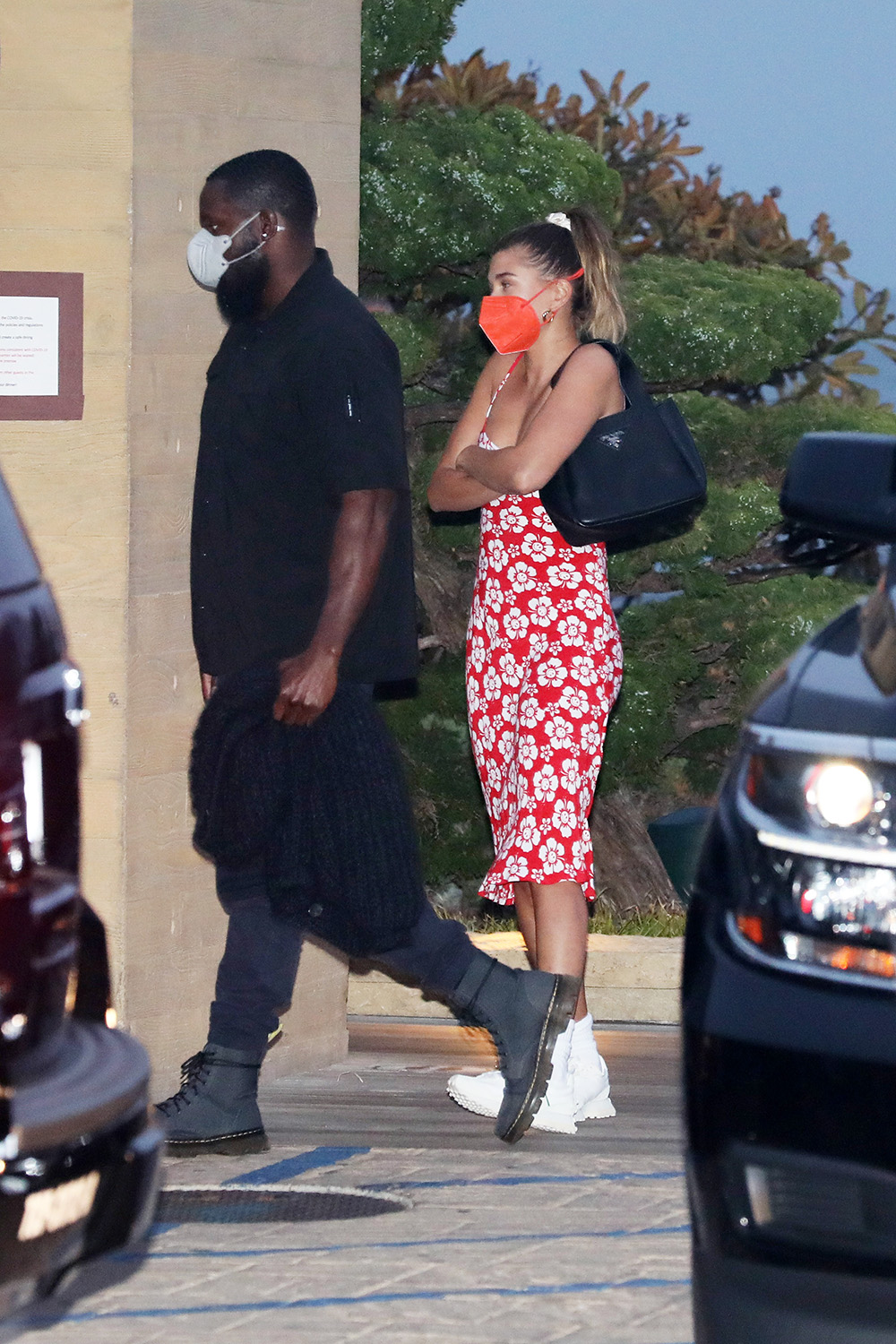 Hailey Bieber wears a red floral dress as she dines at Nobu Malibu