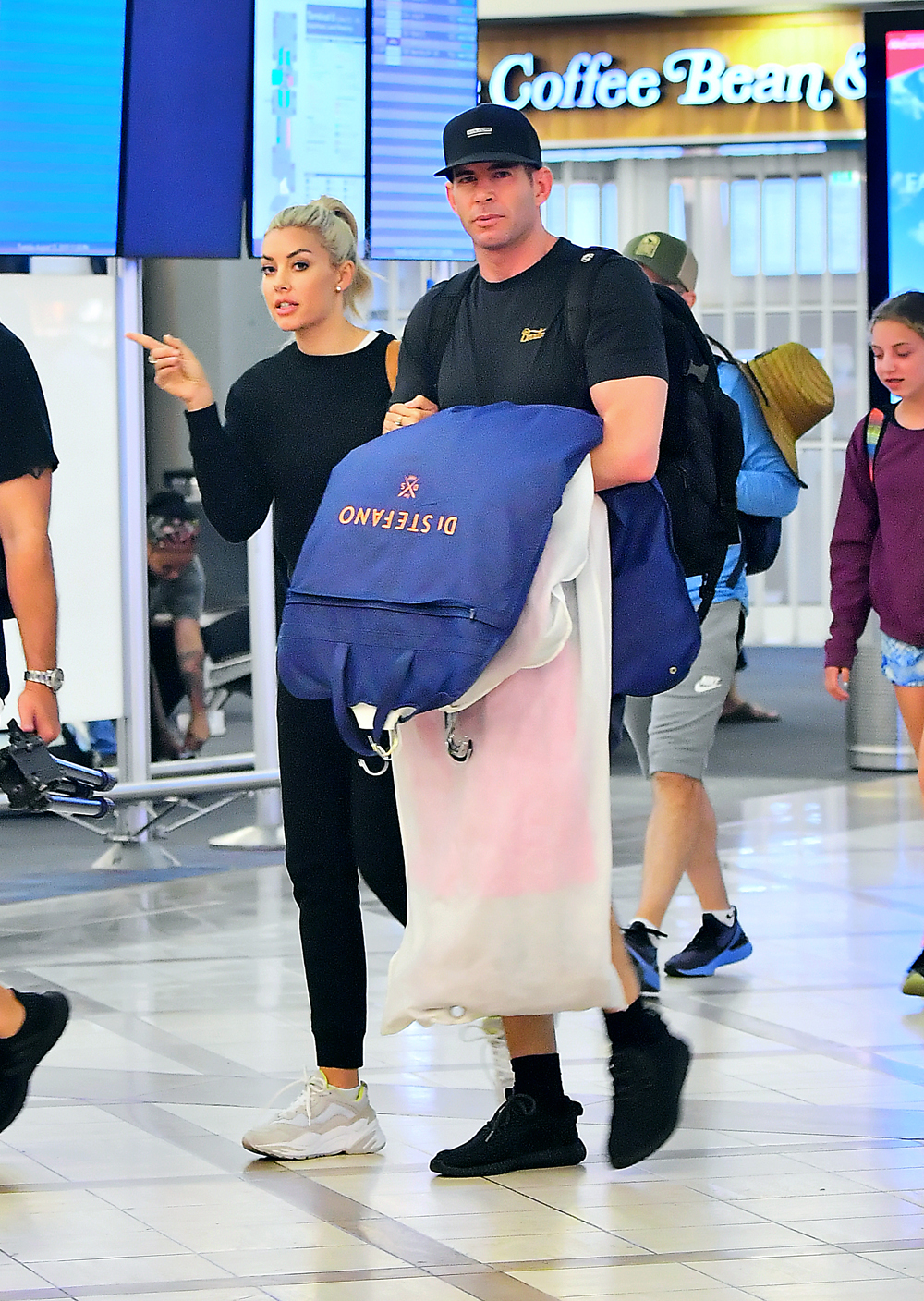 EXCLUSIVE: Tarek El Moussa and Heather Rae Young arrive into LAX