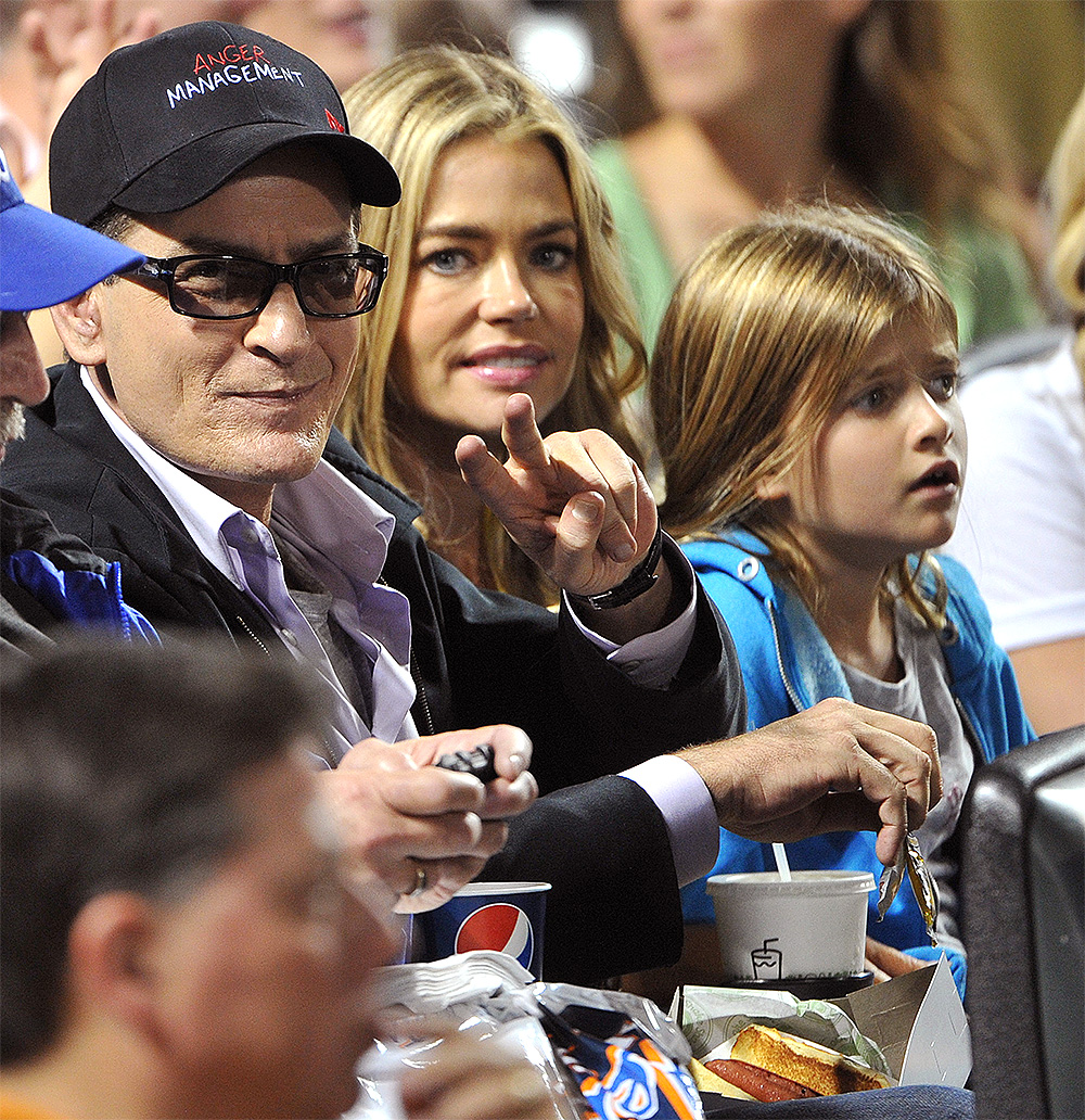 Charlie Sheen, ex-wife Denise Richards and their two daughters promote Charlie's new television series Anger Managemen at a baseball game between the New York Yankees and New York Mets