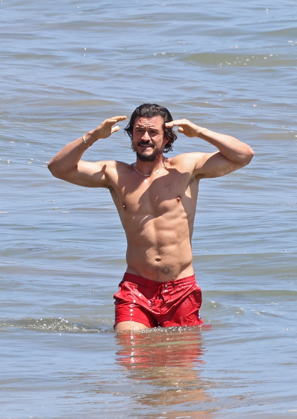 *EXCLUSIVE* Orlando Bloom, 45  shows off his VERY ripped abs at the beach