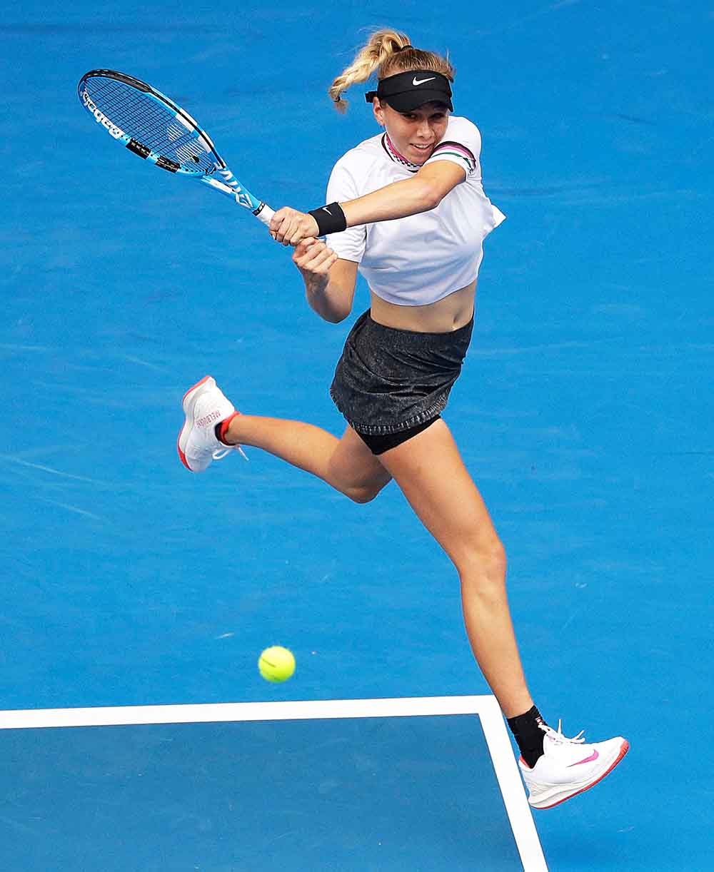 United States' Amanda Anisimova makes a backhand return to Aryna Sabalenka of Belarus during their third round match at the Australian Open tennis championships in Melbourne, Australia
Australian Open Tennis, Melbourne, Australia - 18 Jan 2019