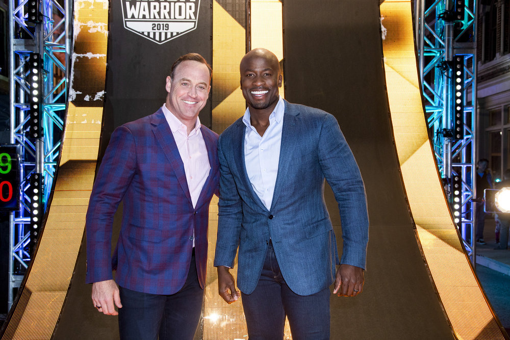 AMERICAN NINJA WARRIOR -- "L.A. Finals" -- Pictured: (l-r) Matt Iseman, Akbar Gbajabiamila -- (Photo by: Lara Solanki/NBC)