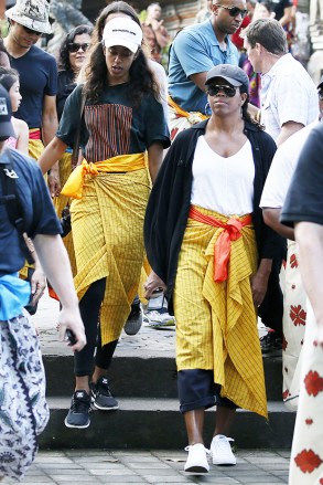 Former US First Lady Michelle Obama (R) and her daughter Malia Obama (L) visit the Tirta Empul Temple during a family holiday in Bali, Indonesia, 27 June 2017. The Obamas are in Bali as part of a ten-day family holiday in Indonesia.Former US president Barack Obama on holiday in Bali, Indonesia, Tampaksiring - 27 Jun 2017