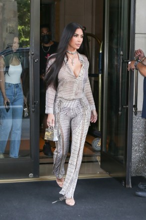 New York, NY  - *EXCLUSIVE*  - Kim Kardahian sizzles in head to toe snakeskin as reality star is spotted on surprise trip to NYC. Kim was spotted leaving her hotel and heading to Milo's for lunch with her assistant Tracy and her security guard. The 40 year old cut a stylish figure in a snakeskin print outfit by Cavalli Archive and jewelry from Chrome Hearts. *Shot on July 15, 2021*

Pictured: Kim Kardahian

BACKGRID USA 17 JULY 2021 

USA: +1 310 798 9111 / usasales@backgrid.com

UK: +44 208 344 2007 / uksales@backgrid.com

*UK Clients - Pictures Containing Children
Please Pixelate Face Prior To Publication*