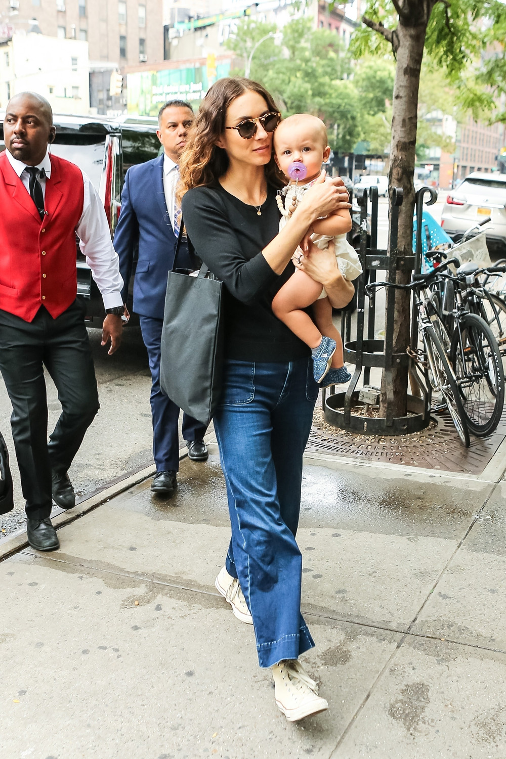 Troian Bellisario arriving at her hotel with her baby girl