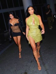 Kim Kardashian is all smiles as she parties with friends in Miami for the opening of the Goodtime Hotel in South Beach. Kim was spotted inside with owner David Grumman who she surprised for the event and then later headed to Papi Steak and her luxury hotel. She was in a custom Lamborghini and Rolls Royce with Jonathan Cheban and longtime friends Stephanie Sheppard and Simon Huck. The friends all had a laugh as they waited for their cars to head to the event. The 40-year-old reality TV bombshell, who is in the process of divorcing her third husband Kanye West, cut a typically glamorous figure on her latest night out. She slid her iconic hourglass frame into a glimmering golden peekaboo dress that showed off her cleavage to full advantage. 17 Apr 2021 Pictured: Kim Kardashian. Photo credit: MEGA TheMegaAgency.com +1 888 505 6342 (Mega Agency TagID: MEGA747211_001.jpg) [Photo via Mega Agency]