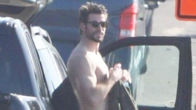 Liam Hemsworth surfing