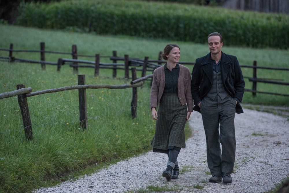 Valerie Pachner and August Diehl in the film A HIDDEN LIFE. Photo by Reiner Bajo. © 2019 Twentieth Century Fox Film Corporation All Rights Reserved