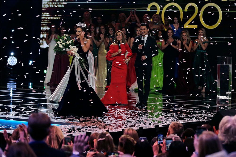 Camille Schrier, of Virginia, left, reacts after winning the Miss America competition at the Mohegan Sun casino in Uncasville, Conn
Miss America, Uncasville, USA - 19 Dec 2019