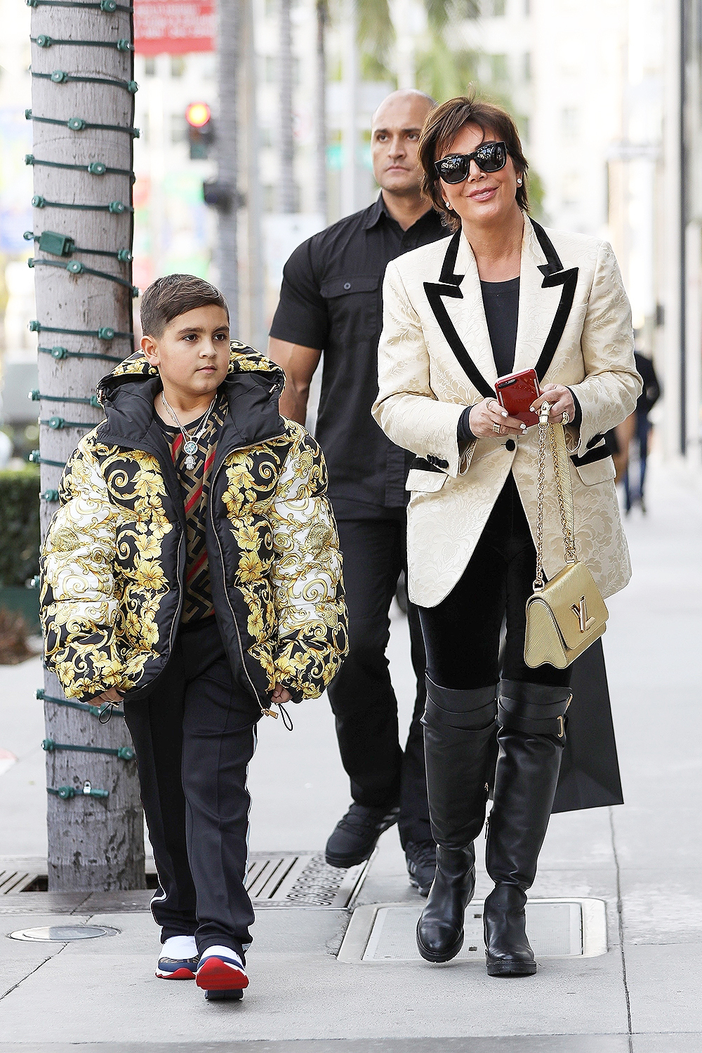 Kris Jenner buys grandson Mason a Versace puffer jacket as they both Christmas shop in Beverly Hills