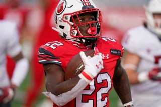 FILE - In this Dec. 19, 2020, file photo, Utah running back Ty Jordan (22) scores against Washington State during the second half of an NCAA college football game, in Salt Lake City. Jordan, a star freshman running back for the University of Utah who grew up in the Dallas area, has died, school officials announced Saturday, Dec. 26. Authorities in Texas and Utah have not released details about the circumstances of the Jordan's death. (AP Photo/Rick Bowmer, File)