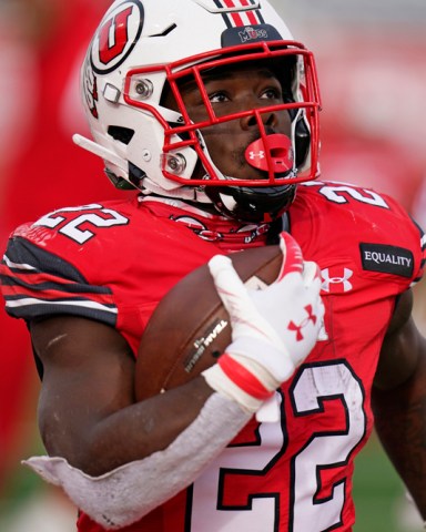 FILE - In this Dec. 19, 2020, file photo, Utah running back Ty Jordan (22) scores against Washington State during the second half of an NCAA college football game, in Salt Lake City. Jordan, a star freshman running back for the University of Utah who grew up in the Dallas area, has died, school officials announced Saturday, Dec. 26. Authorities in Texas and Utah have not released details about the circumstances of the Jordan's death. (AP Photo/Rick Bowmer, File)