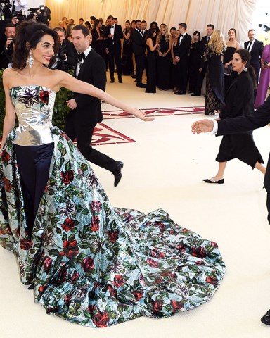 George Clooney and Amal Clooney
The Metropolitan Museum of Art's Costume Institute Benefit celebrating the opening of Heavenly Bodies: Fashion and the Catholic Imagination, Arrivals, New York, USA - 07 May 2018