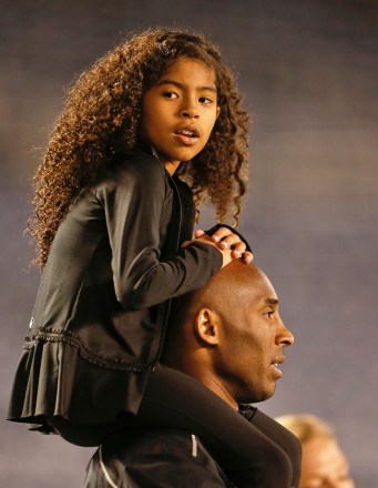 Gianna Bryant sits on the shoulders of her father, Kobe Bryant, as they attend the women's soccer match between the United States and China, in San DiegoChina USA Women soccer, San Diego, USA