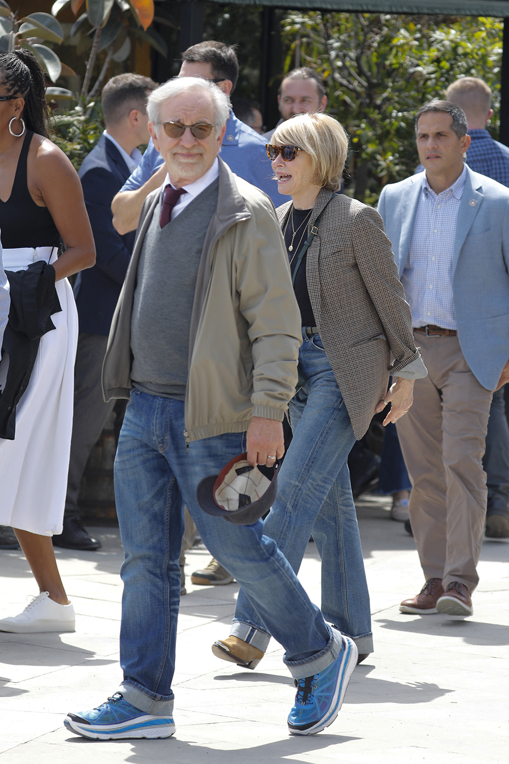 Barack Obama and Michelle Obama walk through Barcelona after visiting the Moco museum and eat with the Spielberg`s.