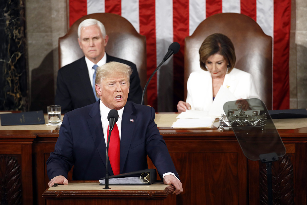 President Donald Trump delivers his State of the Union address to a joint session of Congress on Capitol Hill in Washington, Tuesday, Feb. 4, 2020, as Vice President Mike Pence and House Speaker Nancy Pelosi, D-Calif., watch. (AP Photo/Patrick Semansky)