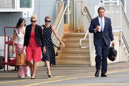 New York Gov. Andrew Cuomo, right, prepares to board a helicopter after announcing his resignation, in New York. Cuomo says he will resign over a barrage of sexual harassment allegations. The three-term Democratic governor's decision, which will take effect in two weeks, was announced Tuesday as momentum built in the Legislature to remove him by impeachment
Cuomo Sexual Harassment, New York, United States - 10 Aug 2021